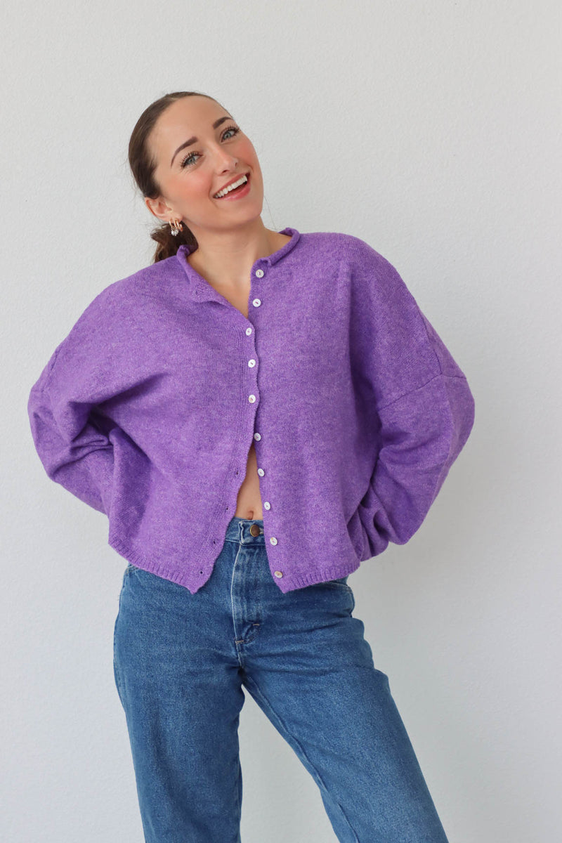 girl wearing purple cardigan