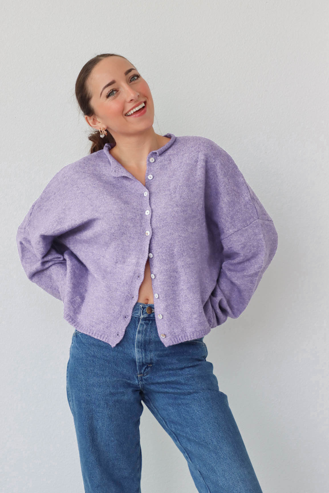 girl wearing light purple cardigan