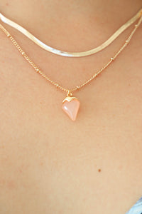 gold chain necklace with pink stone charm