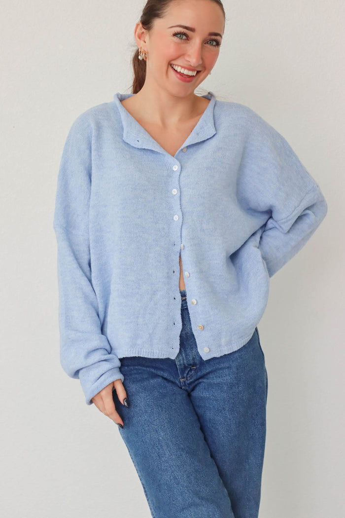 girl wearing light blue cardigan