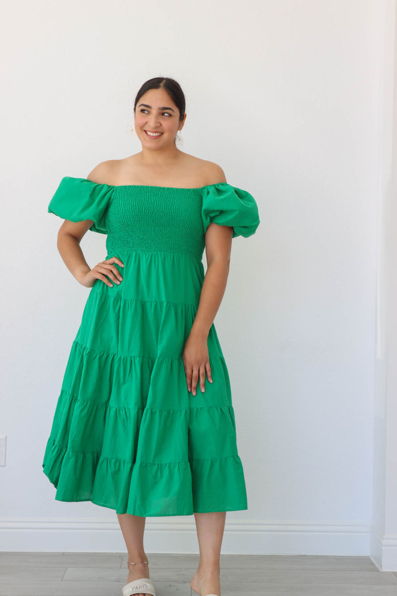 girl wearing long green dress with puff sleeves