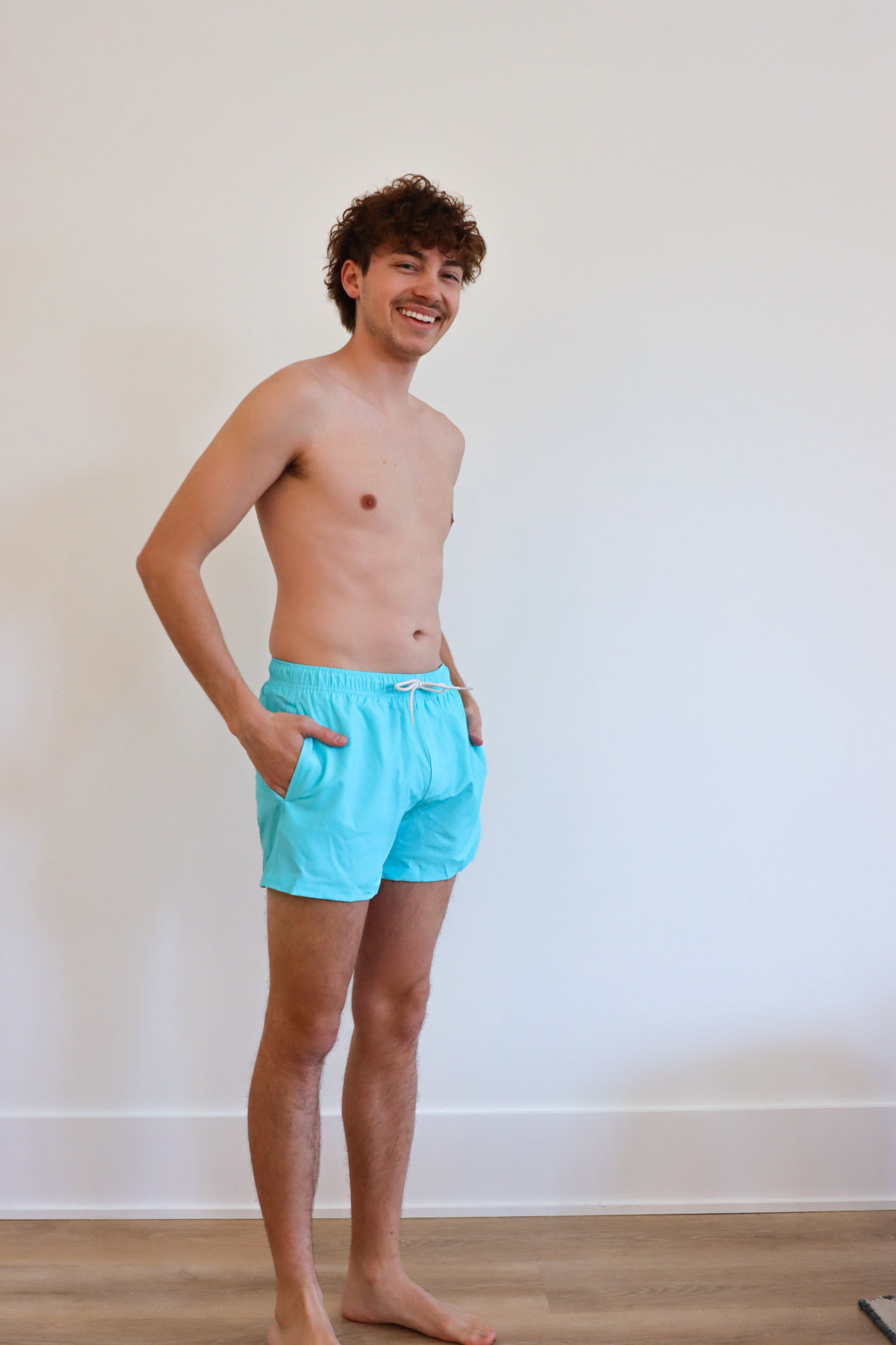 man wearing blue swim trunks