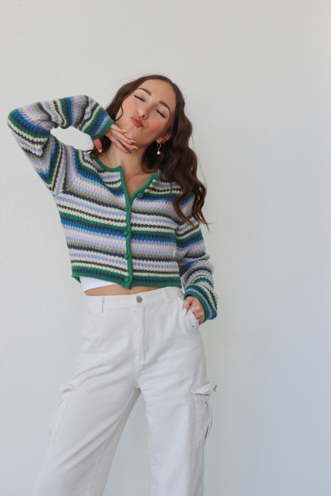 girl wearing multicolor striped cropped cardigan