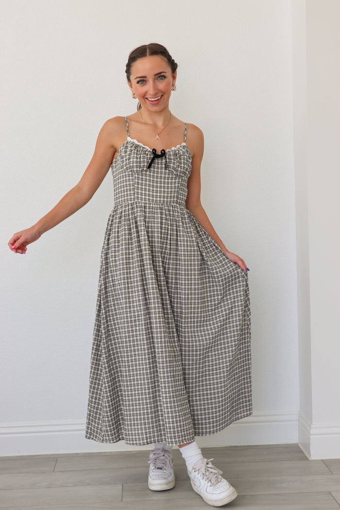 girl wearing black and white checker print dress