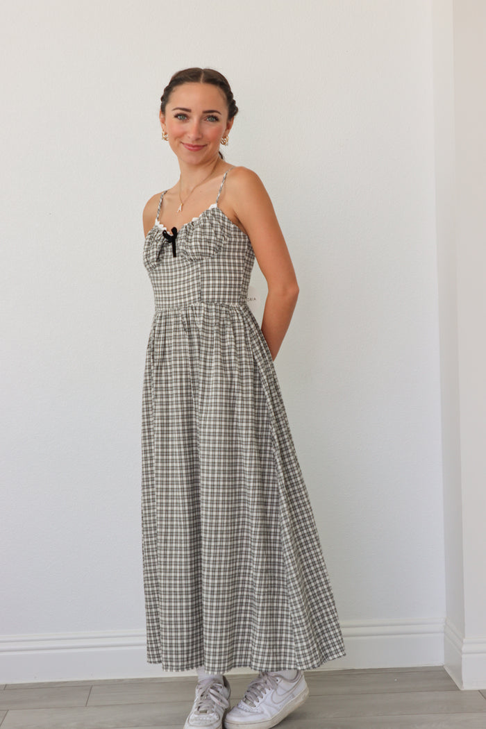 girl wearing black and white checker print dress