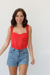 girl wearing red corset top