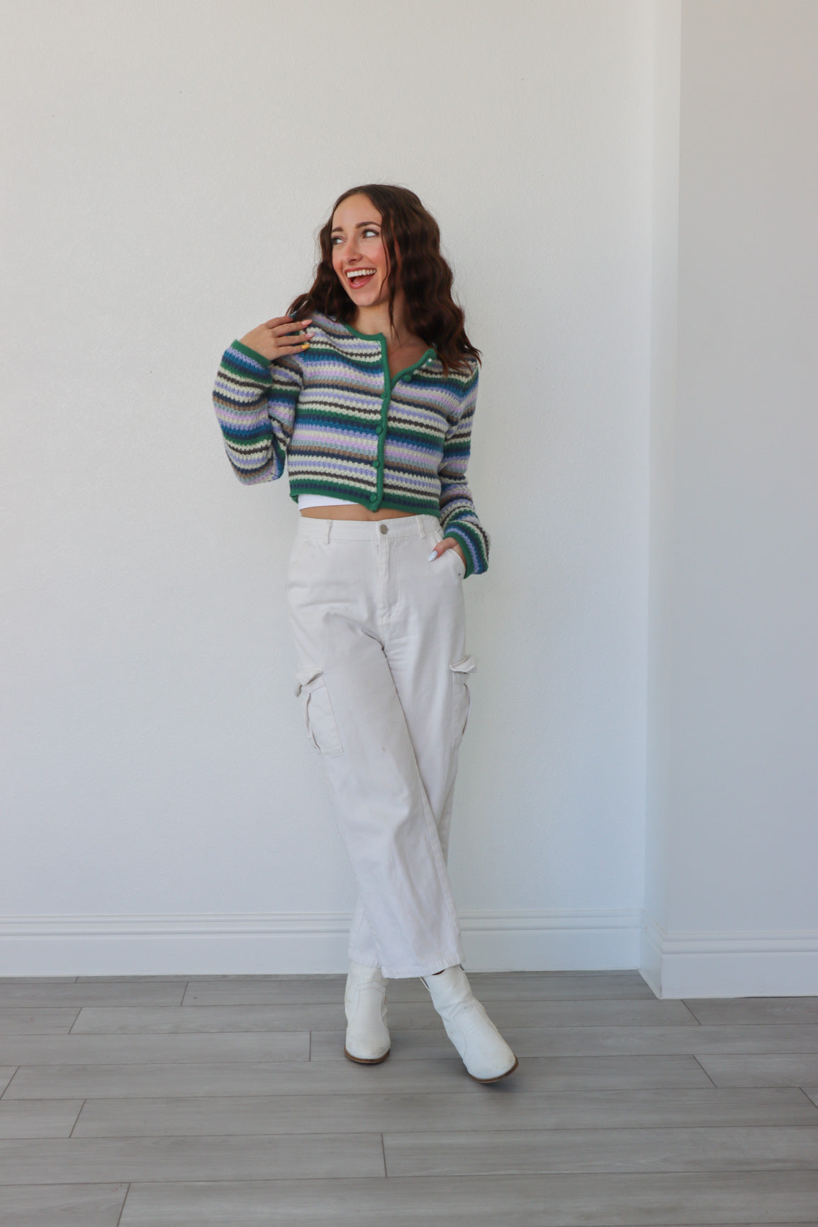 girl wearing multicolor striped cropped cardigan