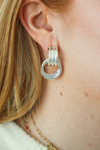 girl wearing silver earrings