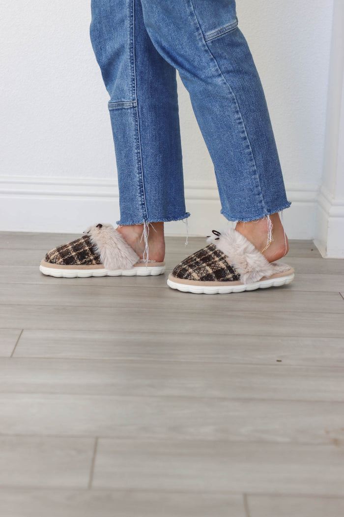 girl wearing black plaid slippers