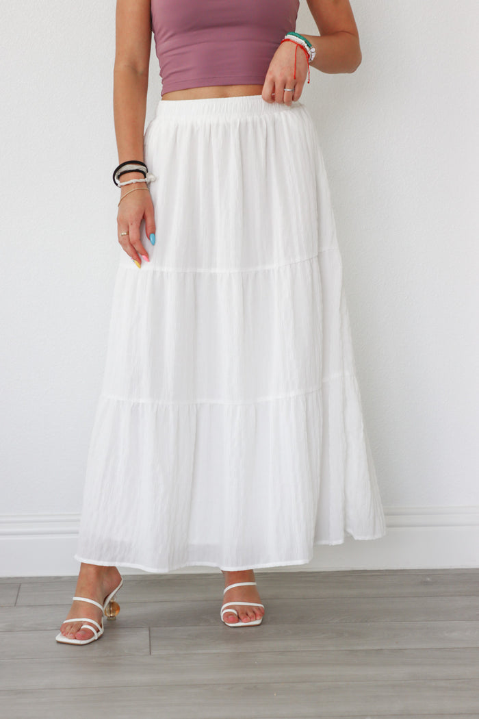 girl wearing white long skirt