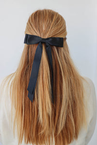 girl wearing black hair bow