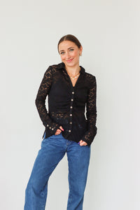 girl wearing black lace button down long sleeve top