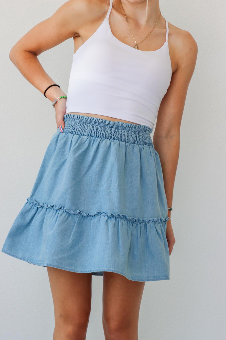 girl wearing light blue chambray skirt