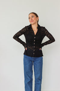 girl wearing black lace button down long sleeve top