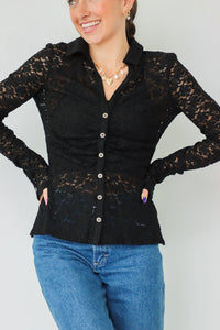 girl wearing black lace button down long sleeve top