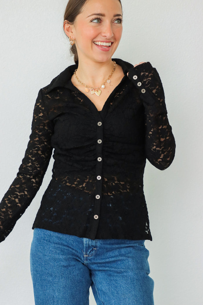 girl wearing black lace button down long sleeve top