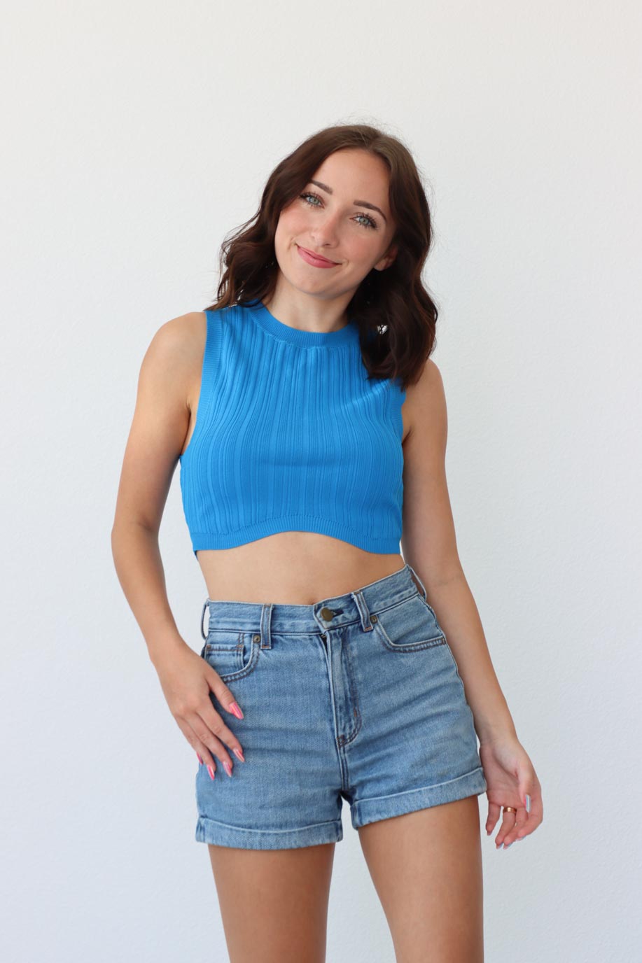 girl wearing cropped blue tank top