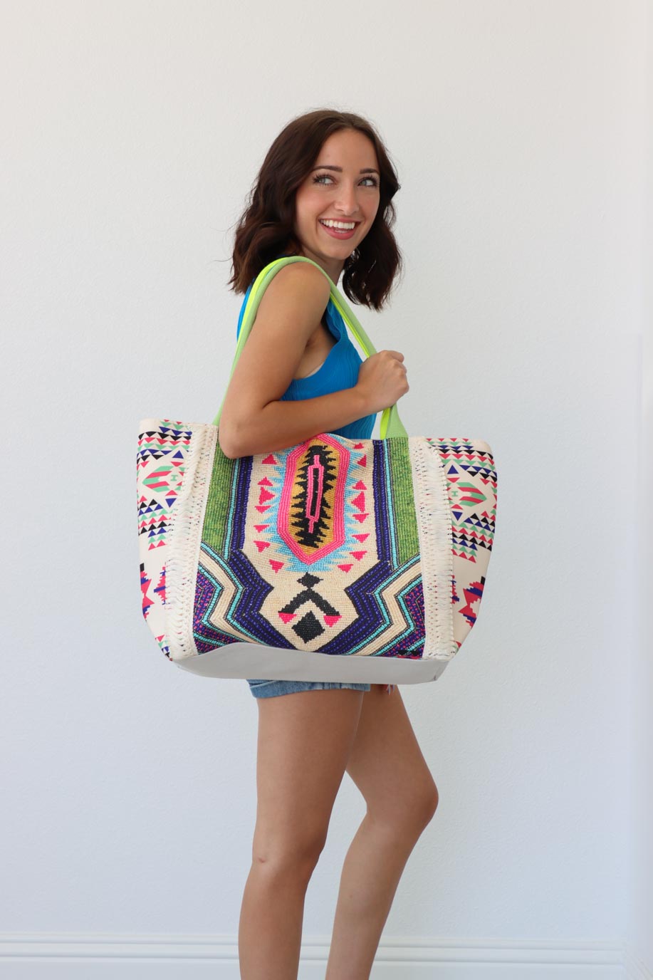 girl carrying multicolored large tote bag