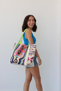girl carrying multicolored large tote bag