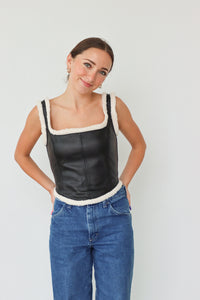 girl wearing faux leather tank top with sherpa detailing