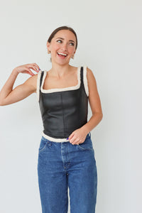 girl wearing faux leather tank top with sherpa detailing