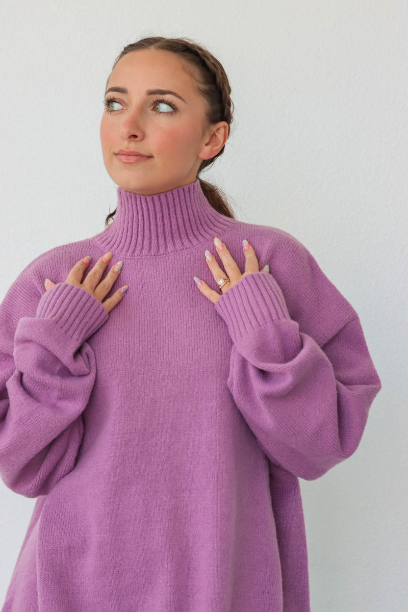 girl wearing purple turtleneck sweater
