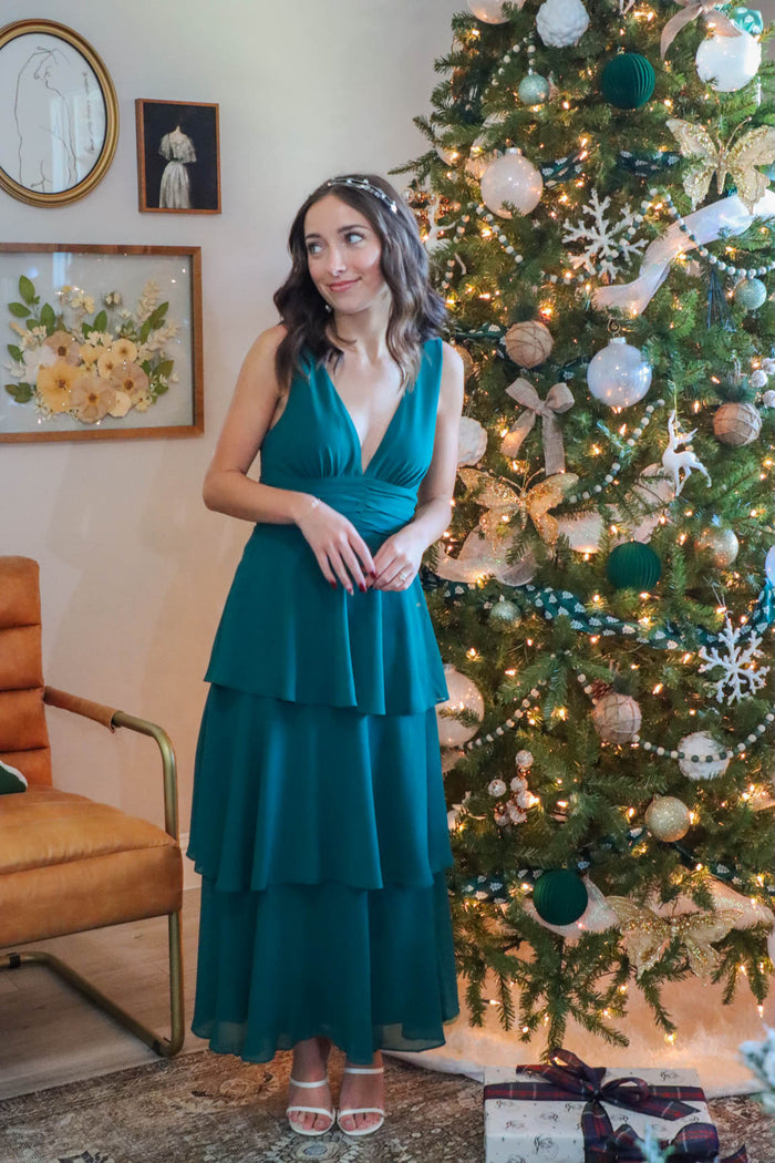girl wearing long green holiday party dress