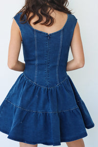 girl wearing dark blue denim dress