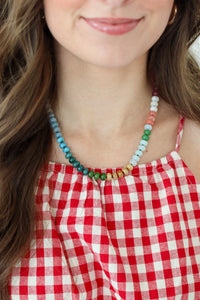 Woman wearing a rainbow beaded necklace 