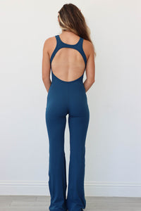 girl wearing teal blue athletic jumpsuit