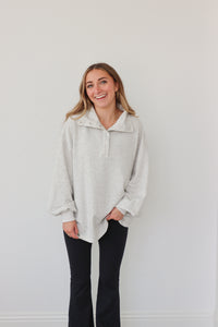 girl wearing light gray pullover