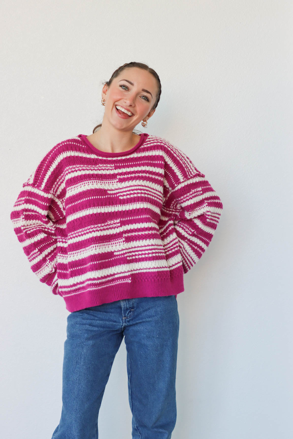 girl wearing purple and white striped knit sweater