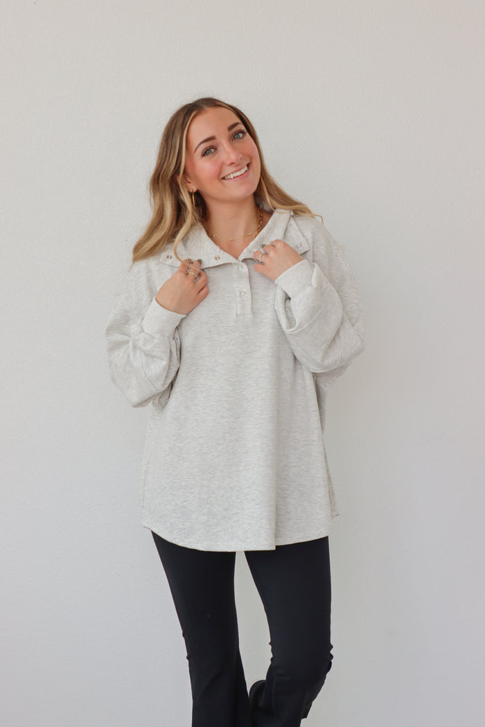 girl wearing light gray pullover