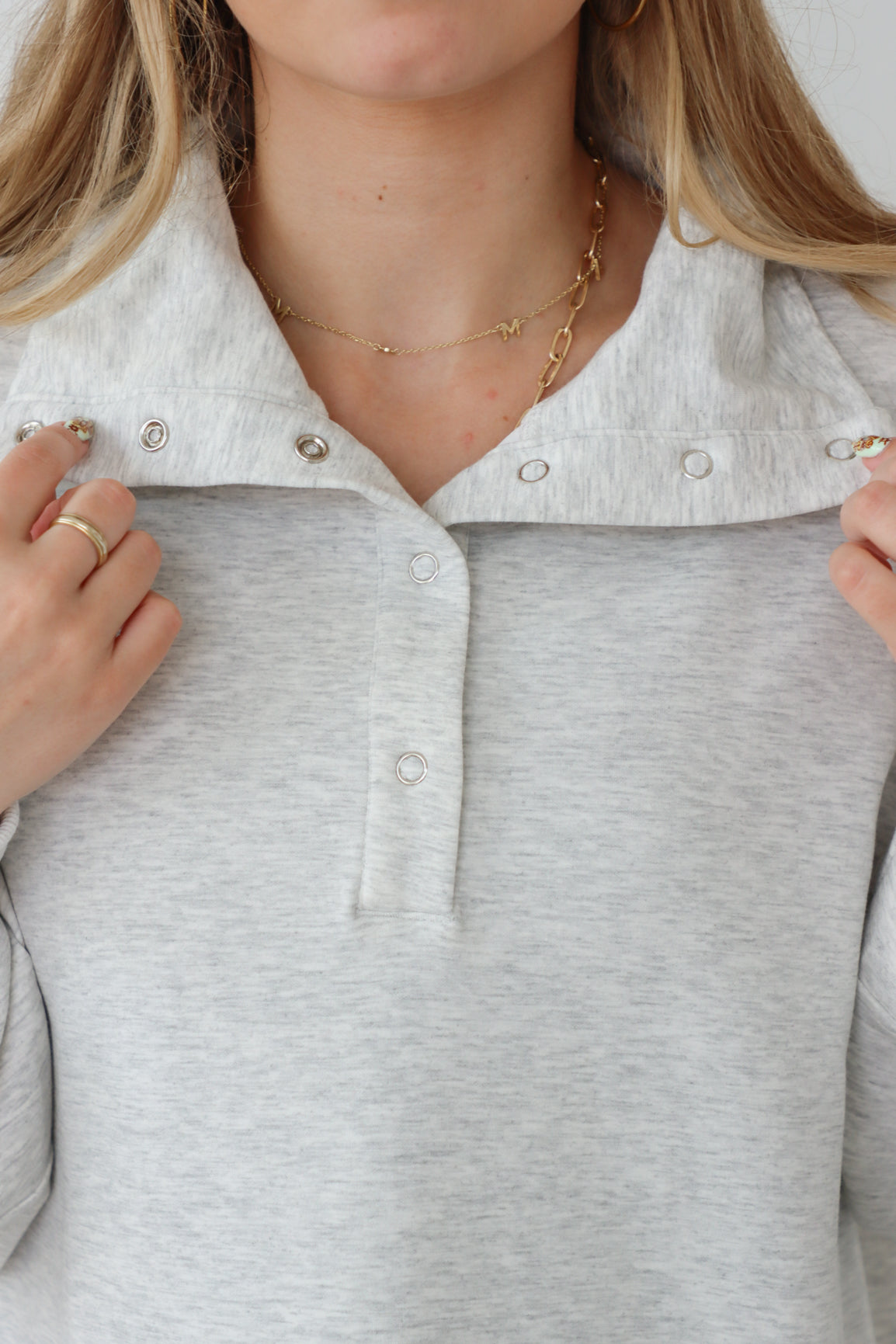 girl wearing light gray pullover