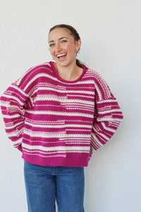 girl wearing purple and white striped knit sweater