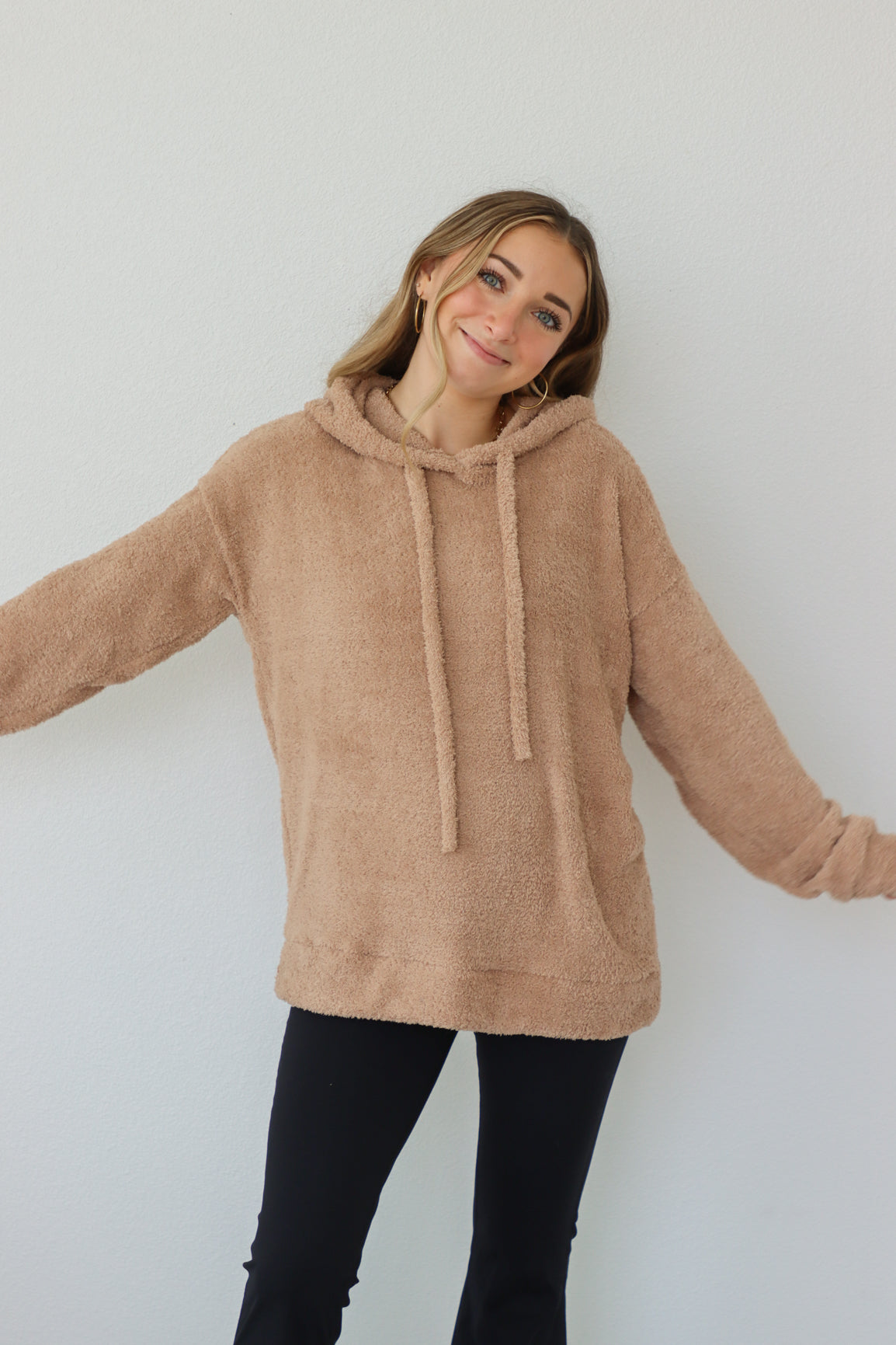 girl wearing tan sherpa hoodie