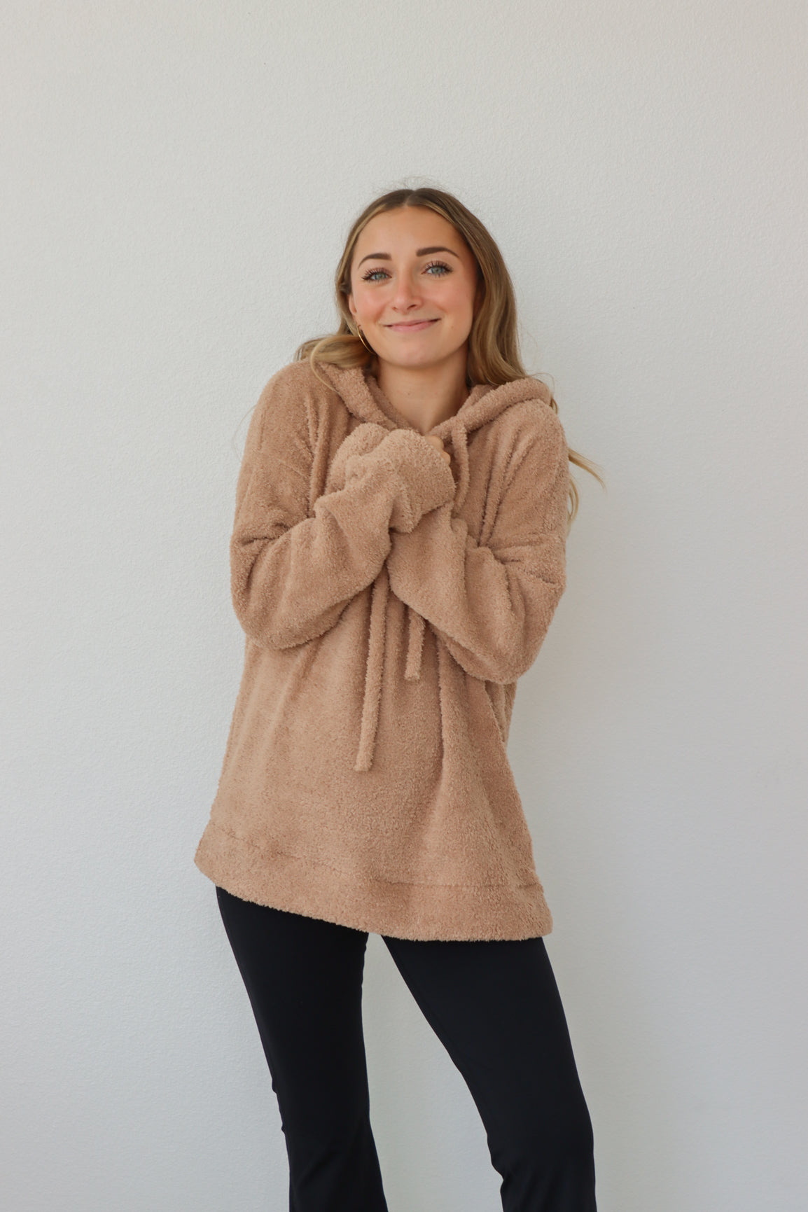 girl wearing tan sherpa hoodie