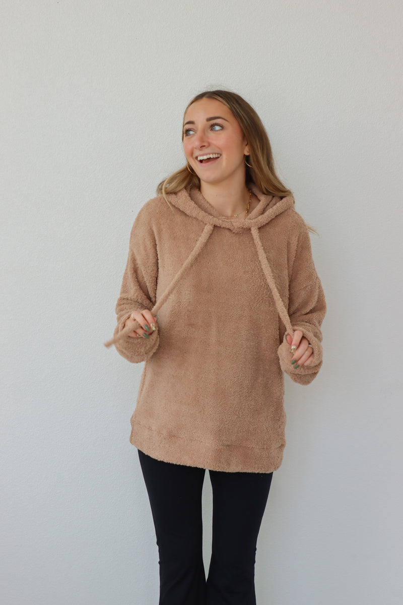 girl wearing tan sherpa hoodie