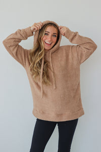 girl wearing tan sherpa hoodie