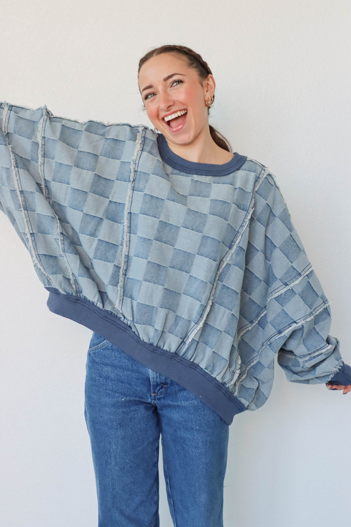 girl wearing blue denim checker print top