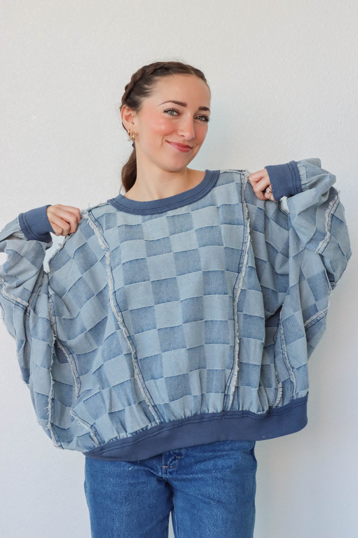 girl wearing blue denim checker print top