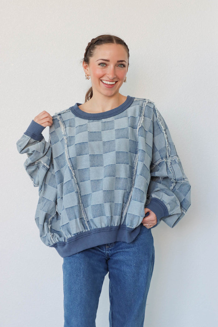 girl wearing blue denim checker print top