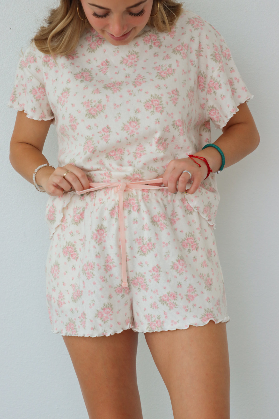 girl wearing light pink floral pj set