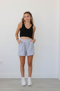 girl wearing heather gray lounge shorts