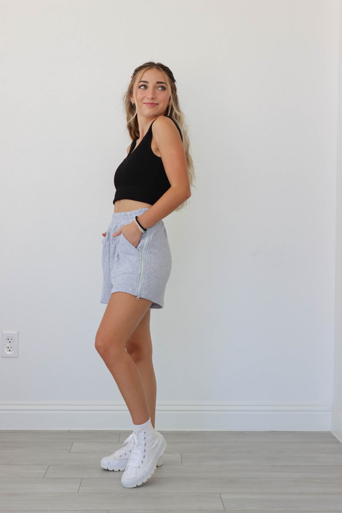 girl wearing heather gray lounge shorts