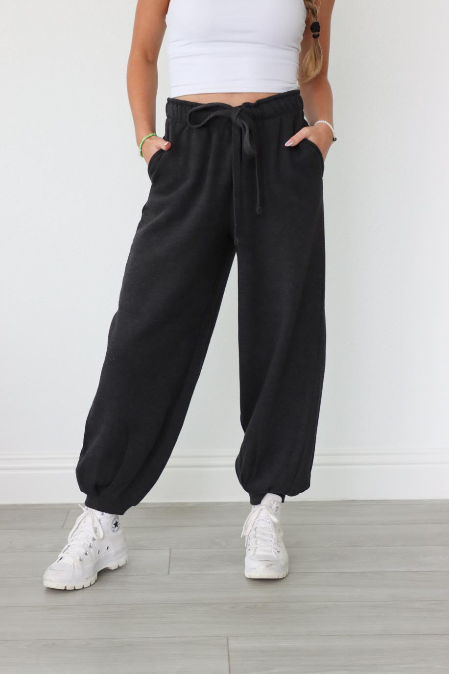girl wearing dark gray drawstring sweatpants