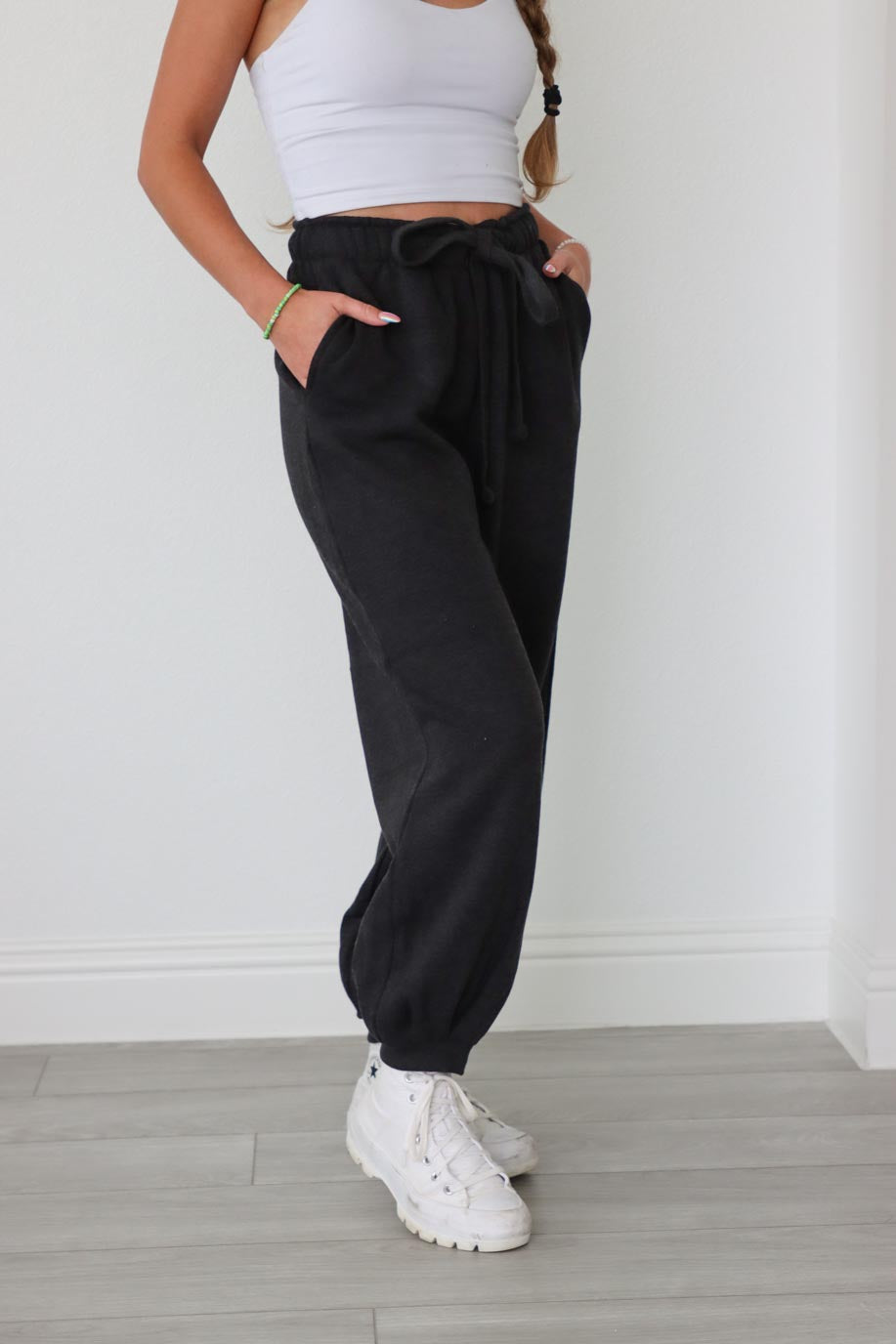 girl wearing dark gray drawstring sweatpants