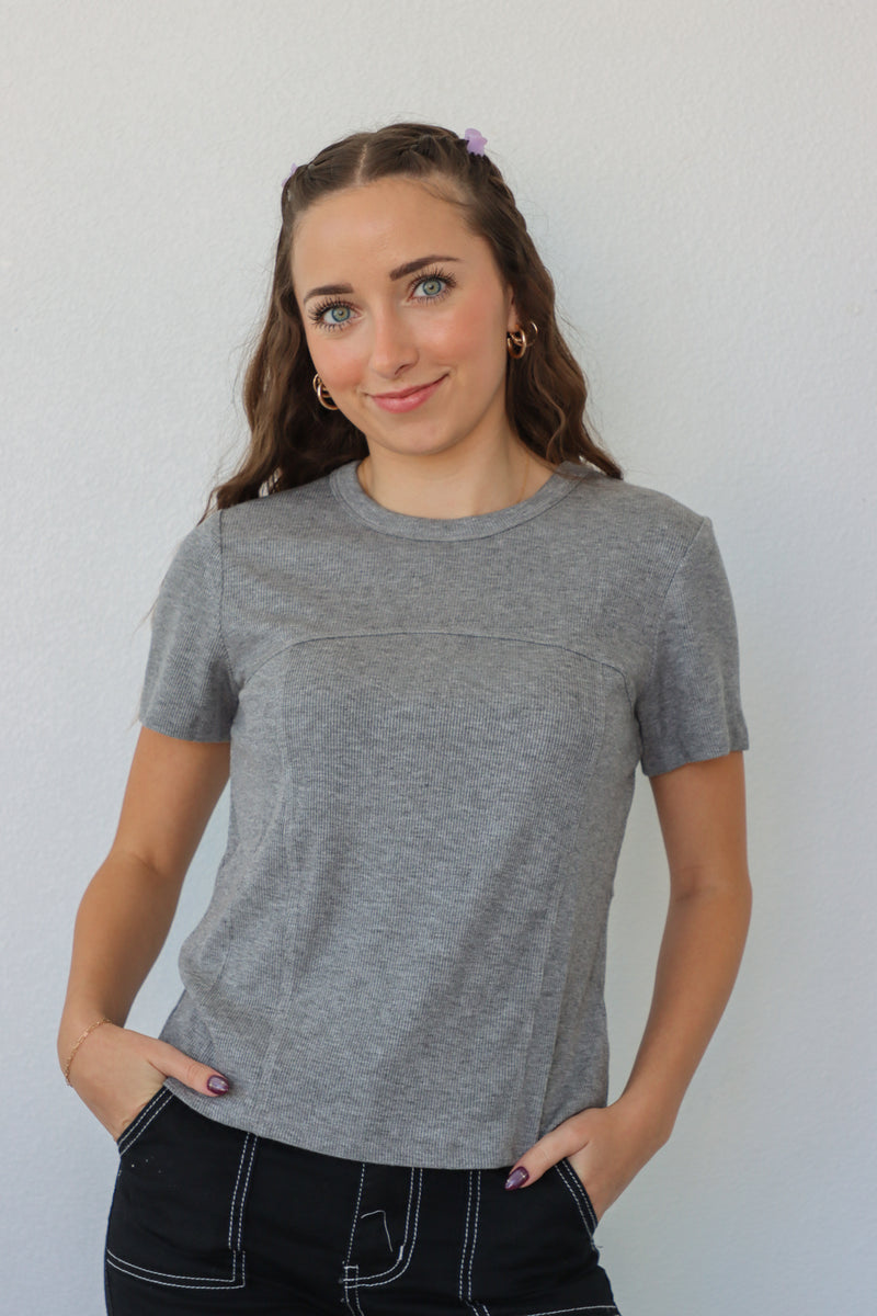 girl wearing gray t-shirt