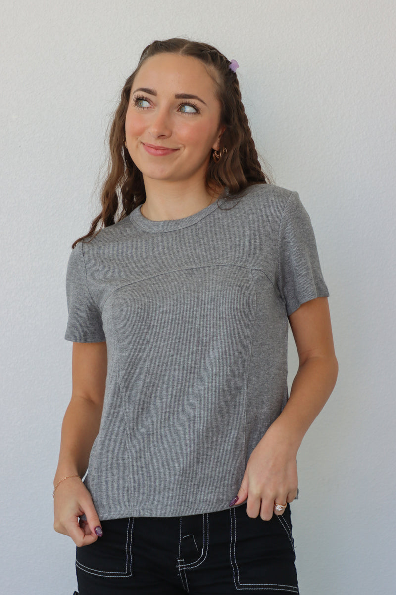 girl wearing gray t-shirt