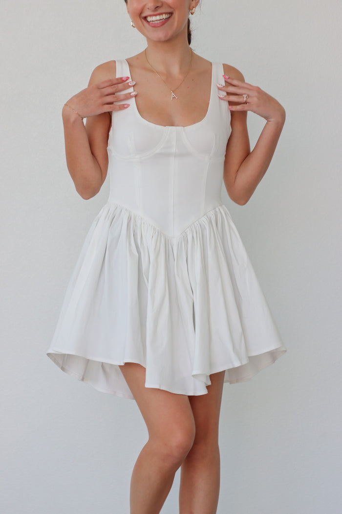 girl wearing white short tank top dress with corset boning